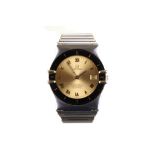 Omega. A stainless steel and gold quartz calendar bracelet watch. Model: Constellation. Date: 1980'