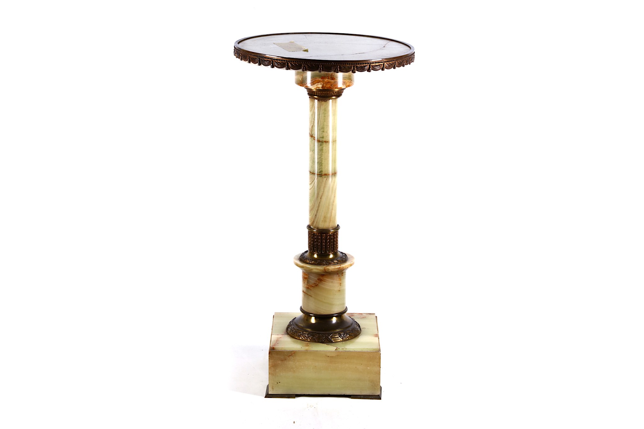 A gilt metal mounted onyx pedestal, mid-20th century, the revolving top on a tapered column and