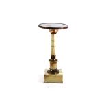 A gilt metal mounted onyx pedestal, mid-20th century, the revolving top on a tapered column and