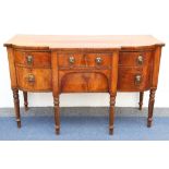 A late Regency mahogany breakfront sideboard, early 19th century, fitted with two central drawers