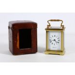 A small French lacquered brass carriage timepiece, early 20th Century, the rectangular white