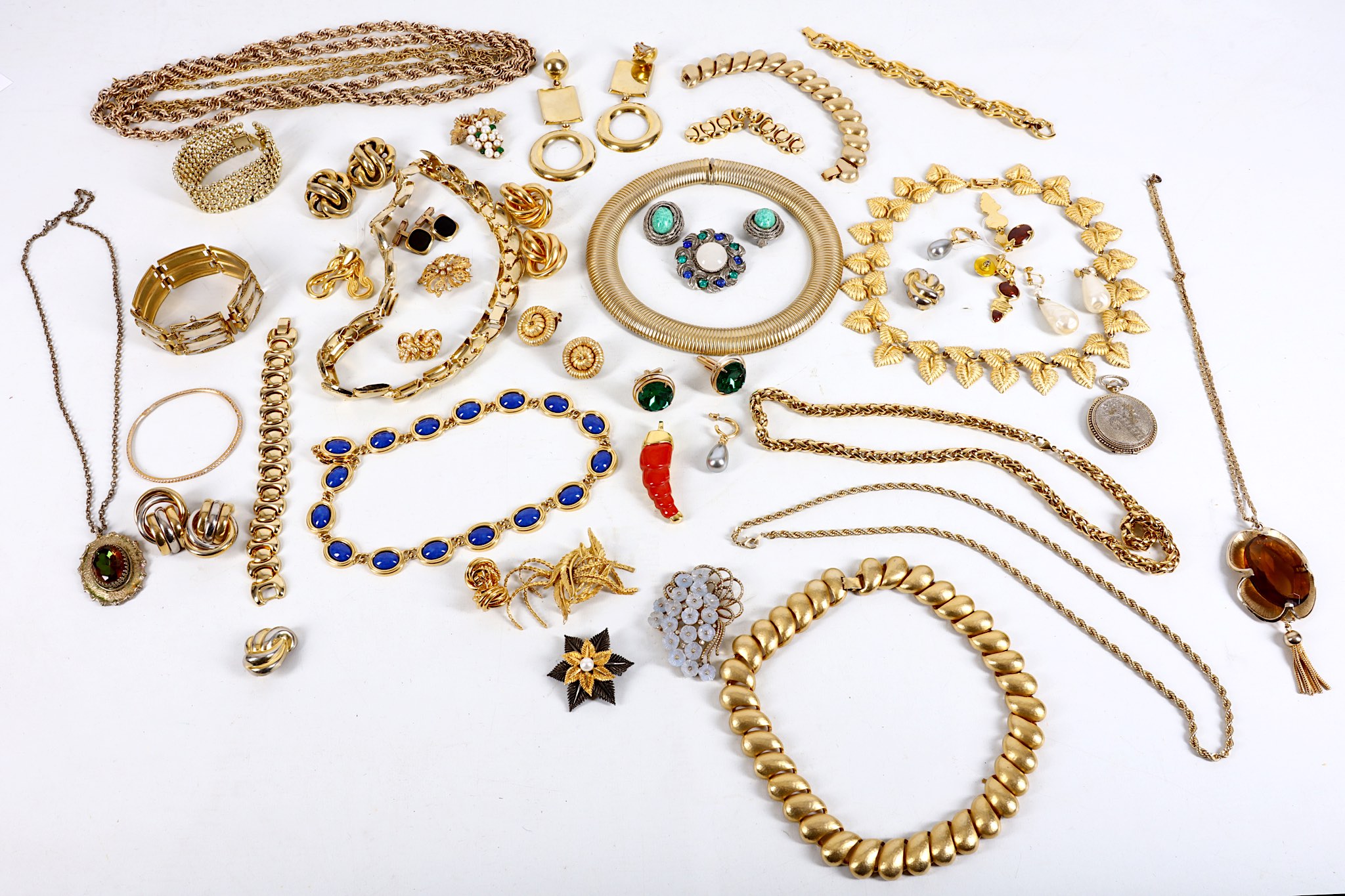 A collection of costume jewellery, mid-20th Century and later, to include gold plated bracelets,