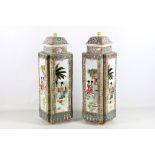 A large pair of Canton porcelain famille rose vases and covers, 20th century, decorated with