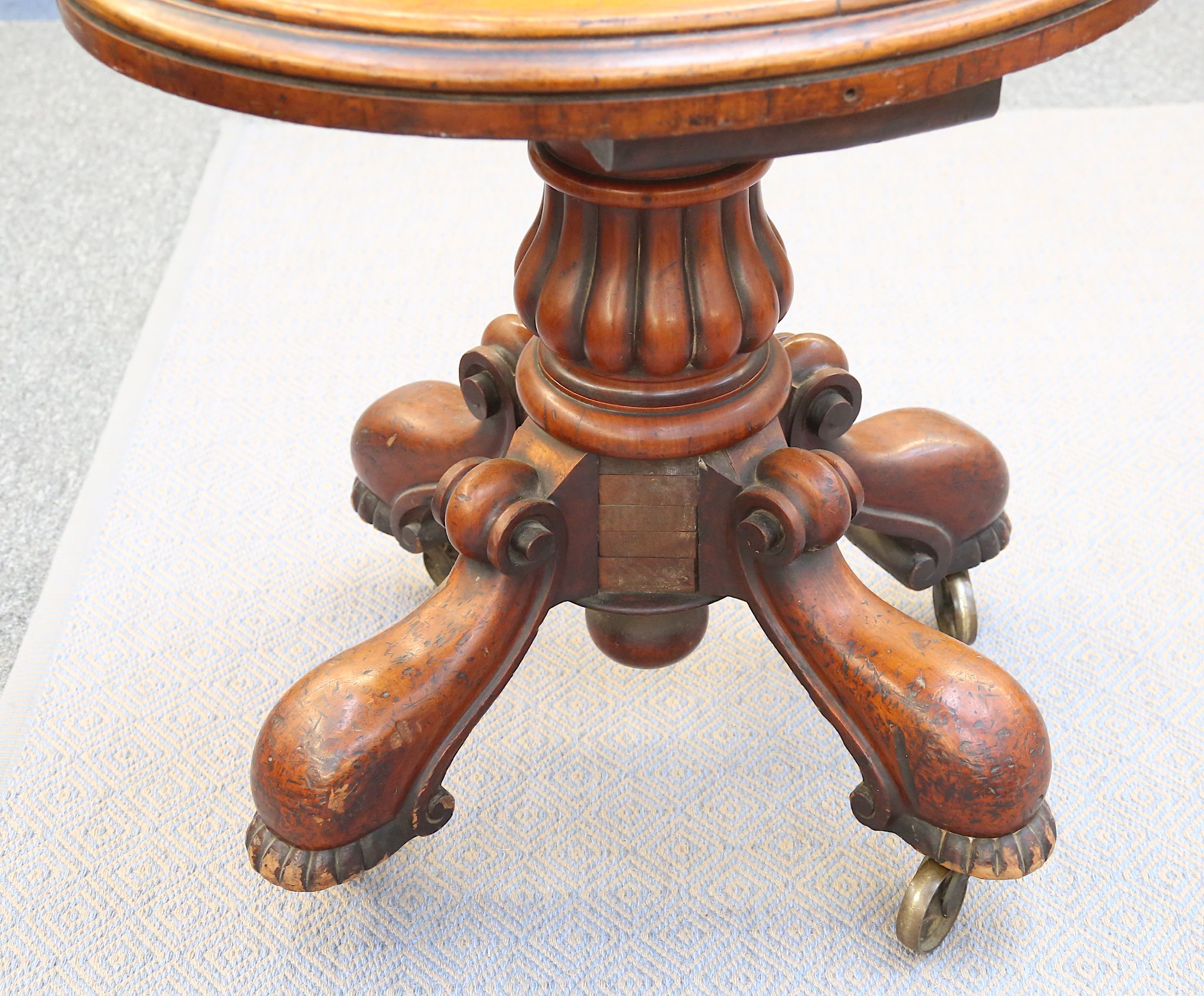 A small Victorian oval mahogany table, 19th Century, with a raised half-edge set onto a heavily - Image 2 of 2