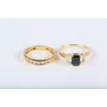 A sapphire and white sapphire three-stone ring, and a brilliant-cut diamond half-hoop ring (2)