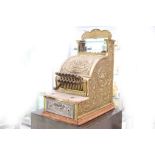 A 'National' American polished cast bronze cash register, with deep decoration, serial no. 759460/