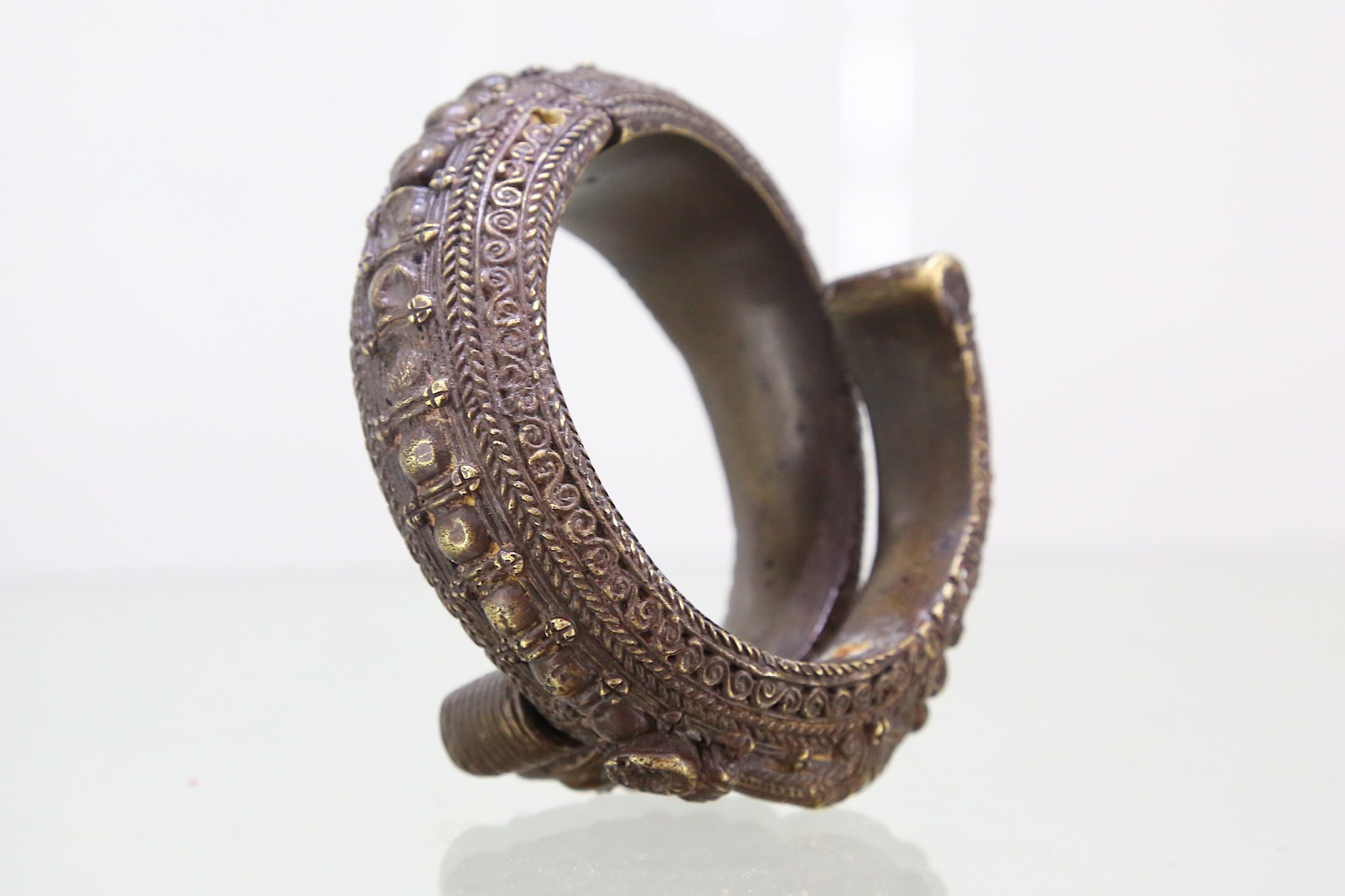A copper Toba Batak bangle, Sumatra, Indonesia, late 19th to early 20th Century, of circular form, - Image 2 of 2