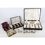 A cased 5-piece sterling silver ladies vanity set, 20th Century, with embossed decoration in