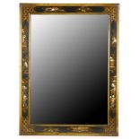 A rectangular Chinoiserie lacquer wall mirror, circa 1920, in black and gold, the rectangular