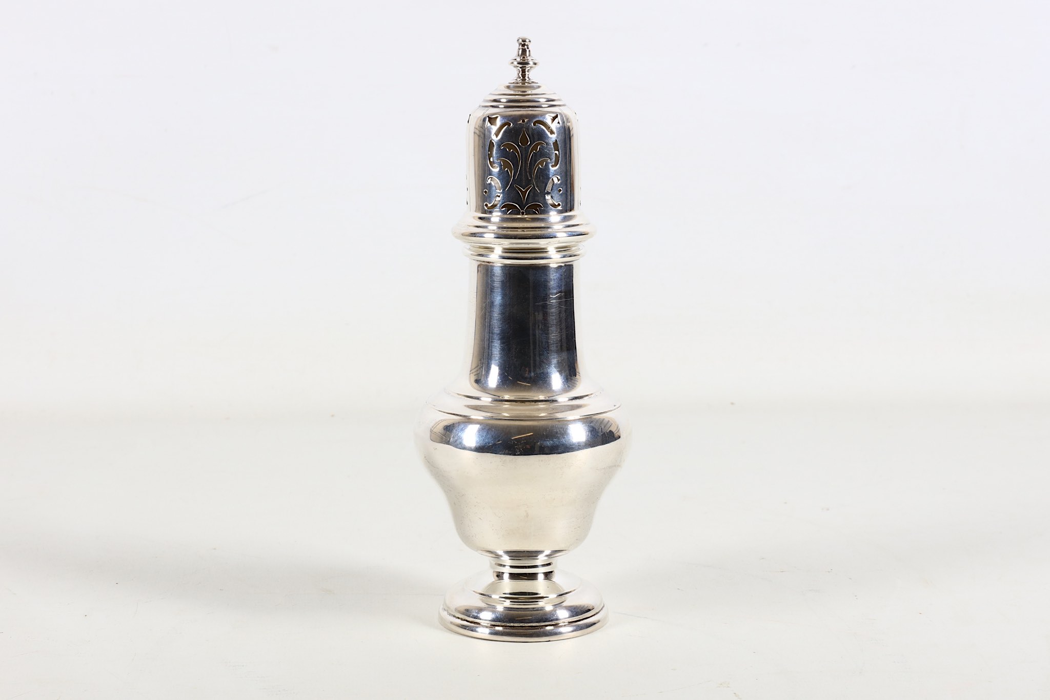 A sterling silver sugar castor, early 20th Century, by Zimmerman, Birmingham 1939, of George III