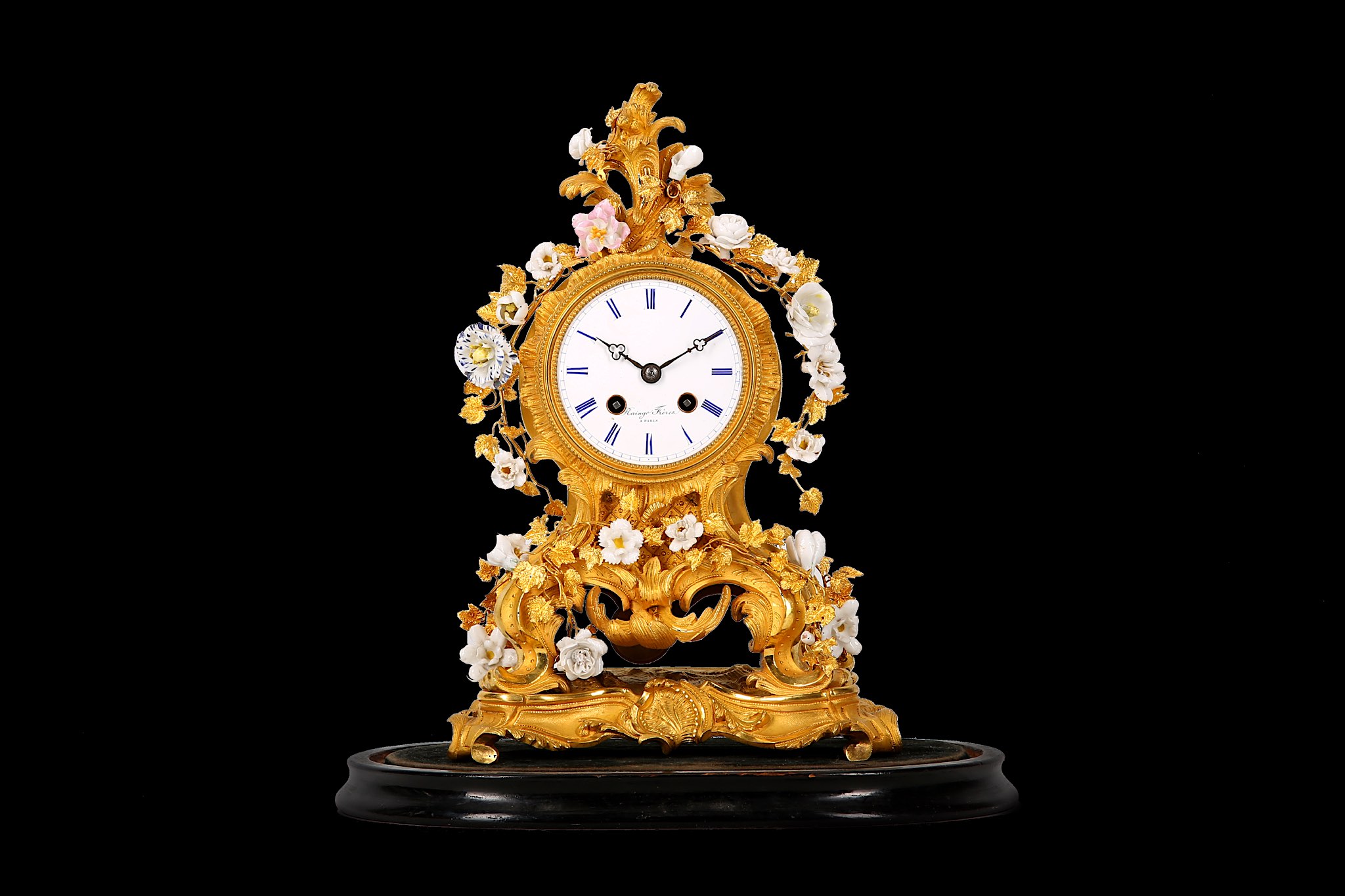 A MID 19TH CENTURY FRENCH GILT BRONZE AND PORCELAIN MOUNTED MANTEL CLOCK BY RAINGO FRERES, PARIS the