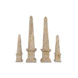 TWO PAIRS OF FOSSIL MARBLE OBELISKS comprising a large pair and a smaller pair, both raised on