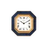 AN ENAMEL AND GILT TRAVELLING ALARM CLOCK BY CARTIER CIRCA 1978 the octagonal faux lapis lazuli case