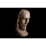 A 13TH / 14TH CENTURY ITALIAN GOTHIC CARVED WOOD HEAD OF CHRIST his eyes closed and mouth slightly