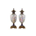 A FINE PAIR OF LATE 19TH CENTURY FRENCH SEVRES STYLE PORCELAIN AND GILT BRONZE MOUNTED VASES AND