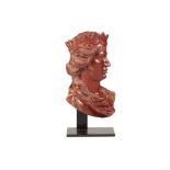 A 17TH / 18TH CENTURY NORTH EUROPEAN ROUGE MARBLE RELIEF BUST OF A QUEEN depicted in profile in