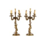 A LARGE PAIR OF 19TH CENTURY FRENCH GILT BRONZE FIGURAL CANDELABRA The stems modelled as a male