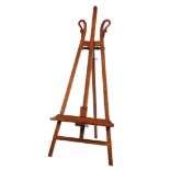 A 19TH CENTURY FRENCH MAHOGANY ADJUSTABLE FLOOR STANDING EASEL IN THE EMPIRE STYLE carved with
