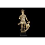 A 17TH CENTURY SOUTH GERMAN GILT BRONZE FIGURE OF A CLASSICAL WARRIOR the soldier wearing a plumed