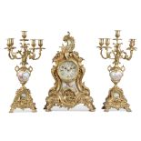 A LARGE EARLY 20TH CENTURY FRENCH GILT METAL AND PORCELAIN MOUNTED CLOCK GARNITURE in the Rococo