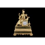 AN EARLY 19TH CENTURY FRENCH ORMOLU MANTEL CLOCK IN THE OTTOMAN TASTE surmounted by a figure of a