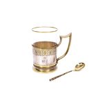 A FINE 19TH CENTURY RUSSIAN SILVER AND SILVER GILT TEA GLASS HOLDER (PODSTAKANNIKS) AND SPOON BY