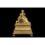 AN EARLY 19TH CENTURY FRENCH EMPIRE PERIOD GILT BRONZE FIGURAL MANTEL CLOCK IN THE OTTOMAN TASTE the