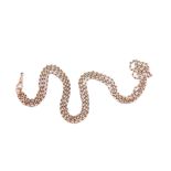 A double-strand fancy-link necklace, suspending an