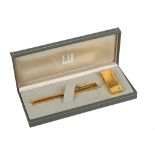 A boxed Dunhill gold plated gentleman's lighter an