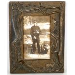 A deep cast bronze frame by H. Bader, 24 x 18.5cm.