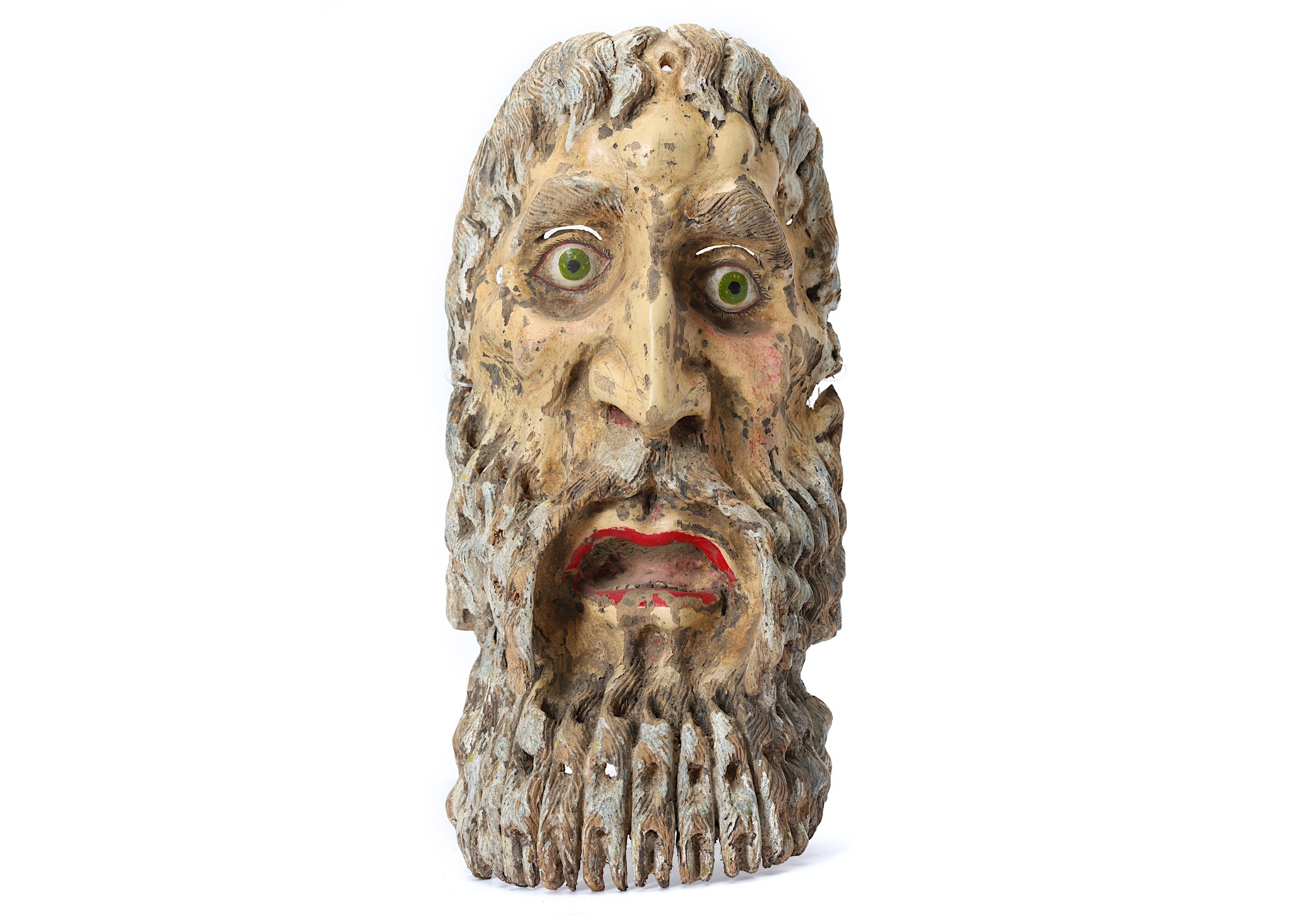 A MEXICAN PAINTED WOOD MASK  Carved in light wood, this mask has a highly expressive face with a