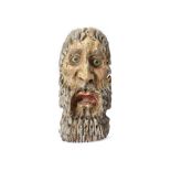 A MEXICAN PAINTED WOOD MASK  Carved in light wood, this mask has a highly expressive face with a