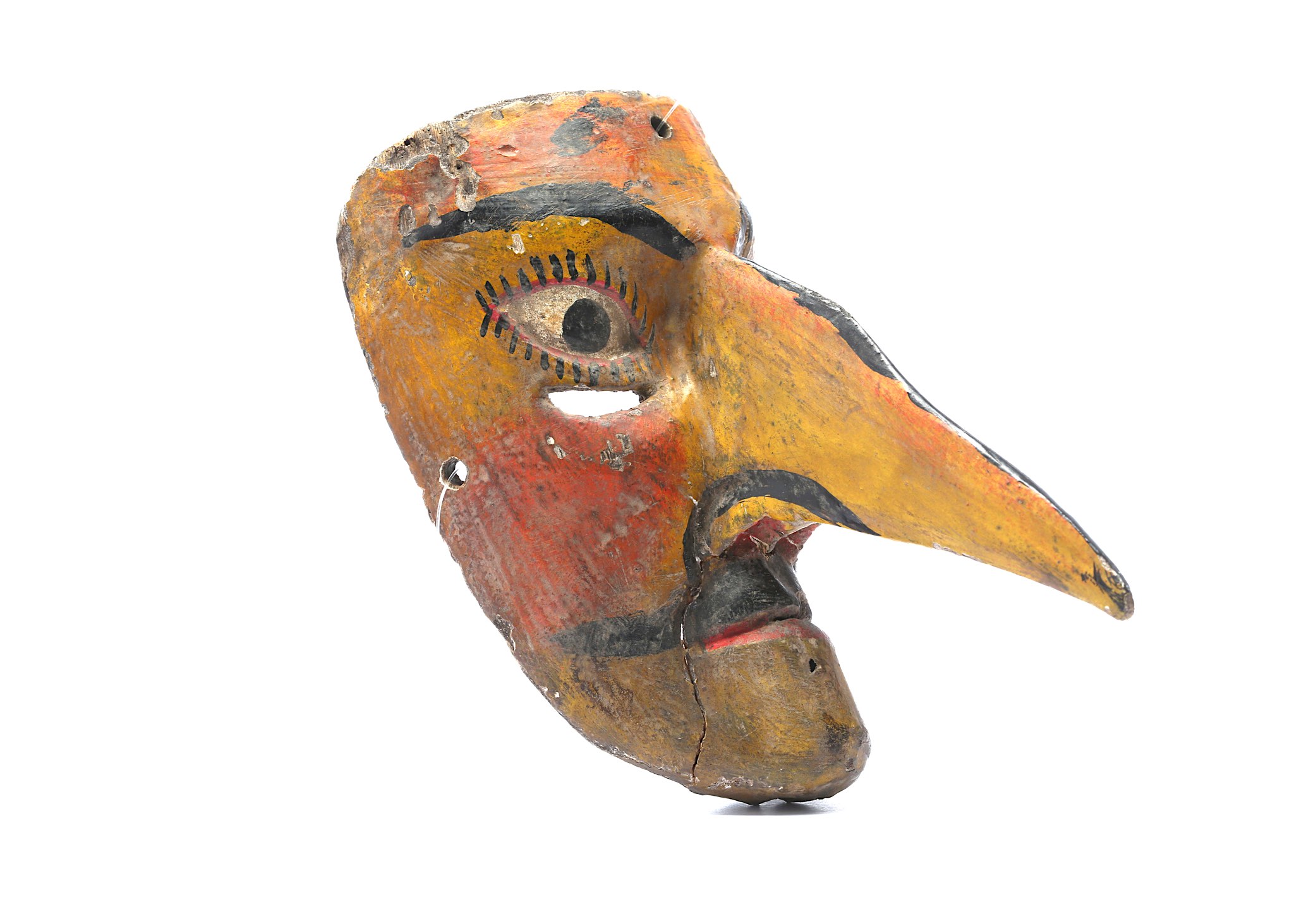 A MEXICAN WOOD MASK  A male caricature with comically enlarged pointed nose that protrudes from