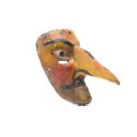 A MEXICAN WOOD MASK  A male caricature with comically enlarged pointed nose that protrudes from