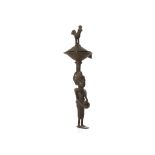 A BENIN-STYLE BRONZE INCENSE BURNER  The handle in the form of a stylised figure with pendulous