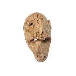 A DOGON MONKEY MASK  Of light wood with a textured surface, the mask has a heavy brow which
