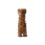 A BONE FIGURINE A highly stylised female figure with a heart shaped face, almond shaped eyes in