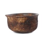 A PAPUA NEW GUINEA COOKING POT A traditional clay pot for cooking on an open fire, with stippled and