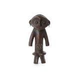A ZANDE WOOD FIGURE, DEMOCRATIC REPUBLIC OF CONGO With a wide heart shaped face, hollow ringed