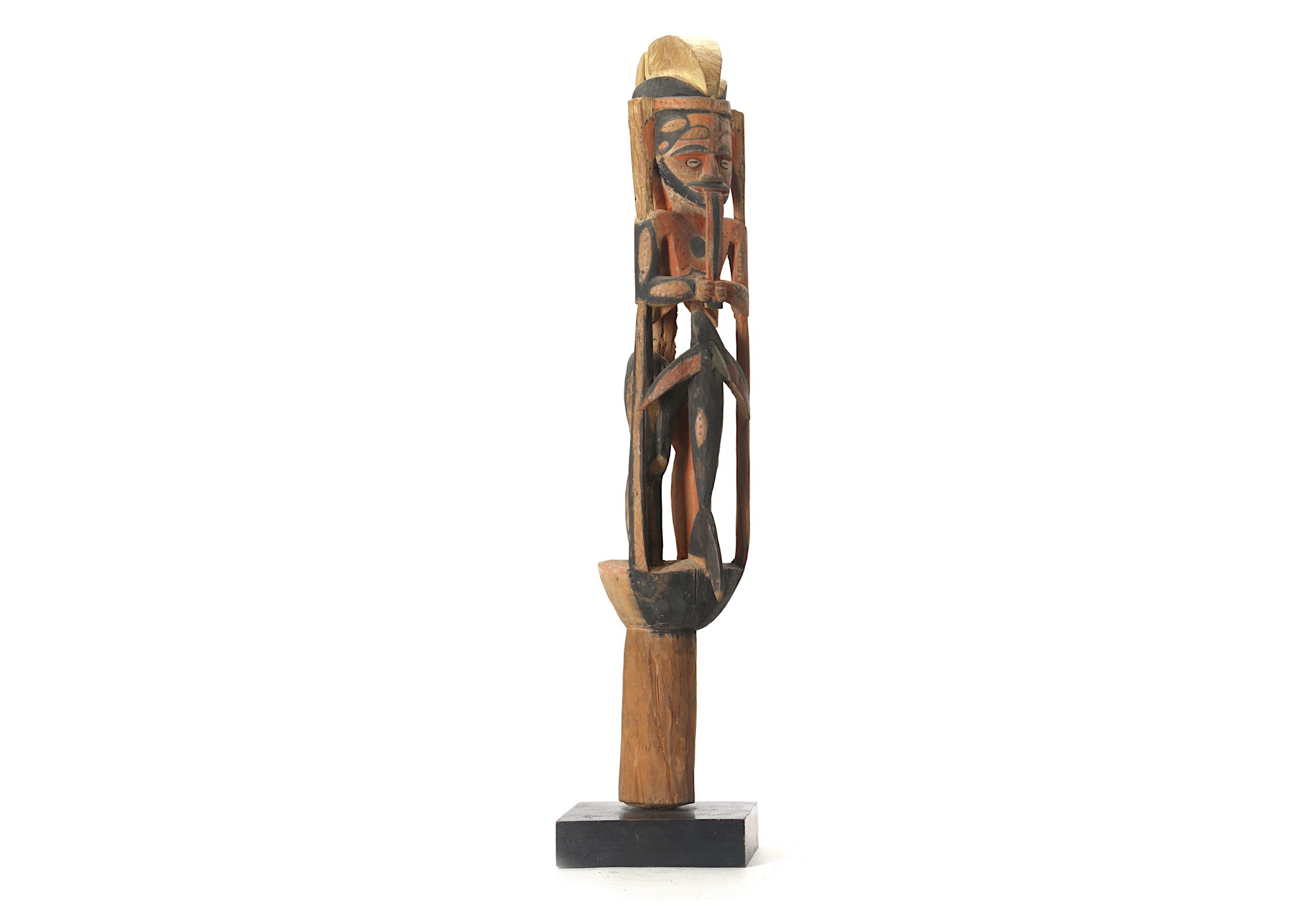 A PAINTED WOOD FIGURE, PAPUA NEW GUINEA Standing on a cylindrical base, the carved stylised figure