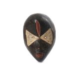 A PAINTED DAN MASK, IVORY COAST  A large mask with a bulbous forehead, the surface of the mask