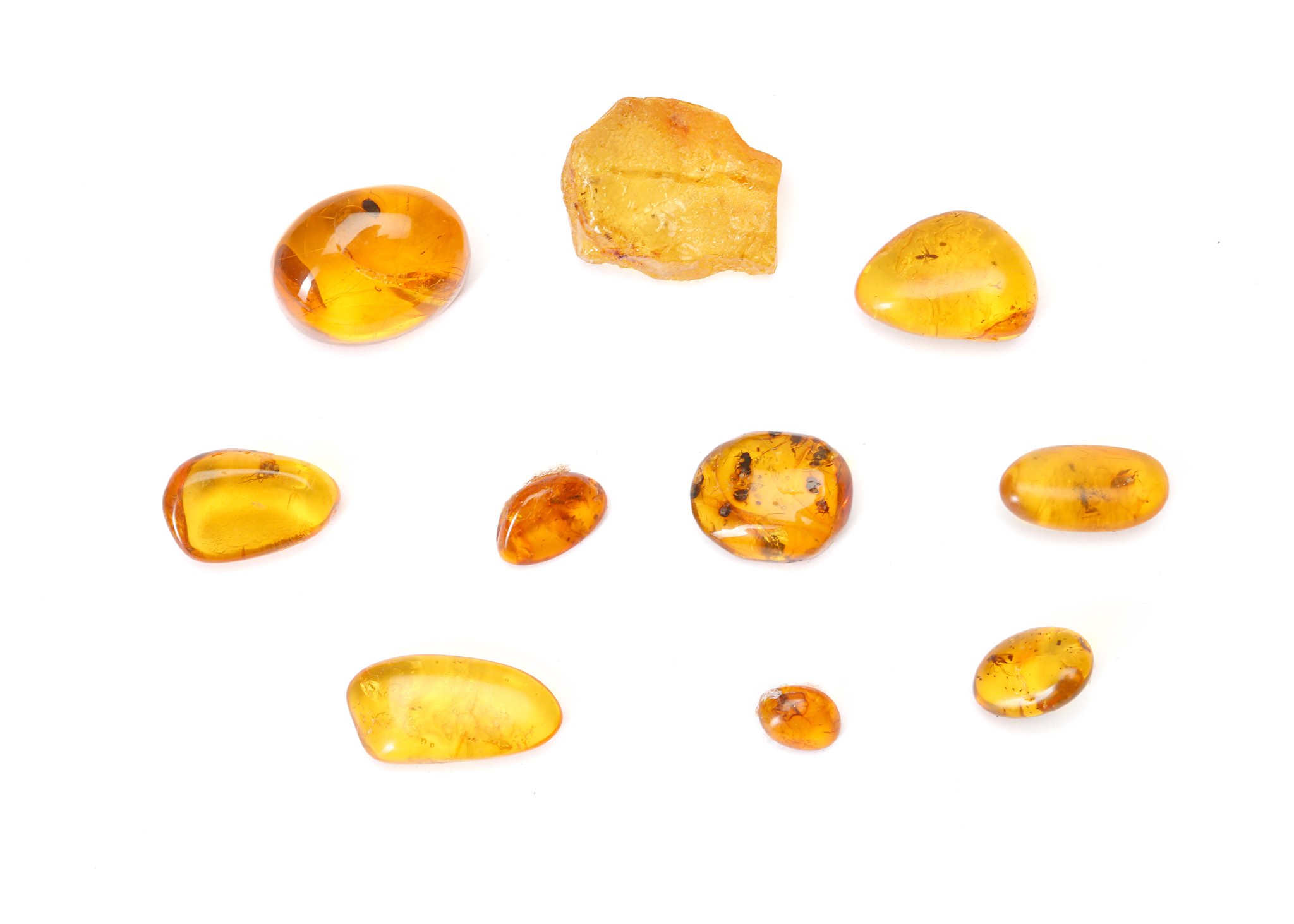A GROUP OF AMBER FRAGMENTS 1cm - 2.1cm long, (10) Footnotes: Amber has been considered to be as