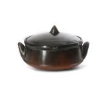 AN AFRICAN POTTERY COOKING BOWL A burnished earthenware bowl with a lid fitting inside lip, from