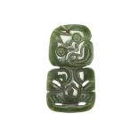 A LARGE MAORI ANTHROPOMORPHIC PENDANT This large example has been carved in the typical green