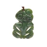 A MAORI ANTHROPOMORPHIC PENDANT Made of particularly fine jadeite with a mottled matt surface,