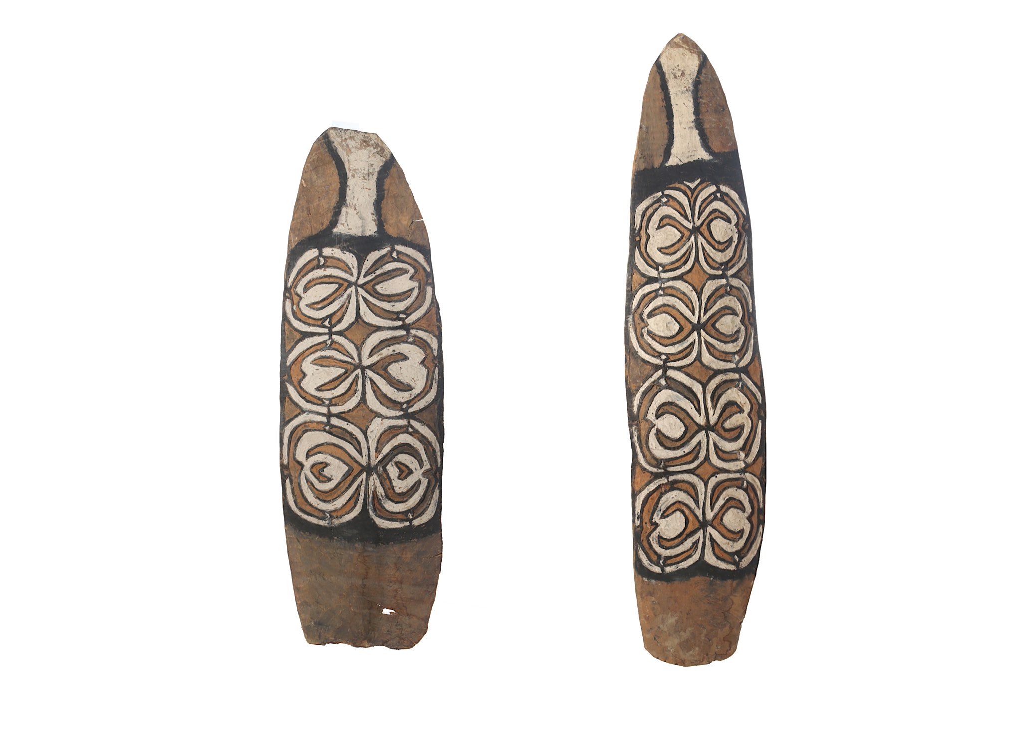 TWO KOROWAI SHIELDS, WESTERN PAPUA NEW GUINEA Both shields of oblong form with a curved top, the