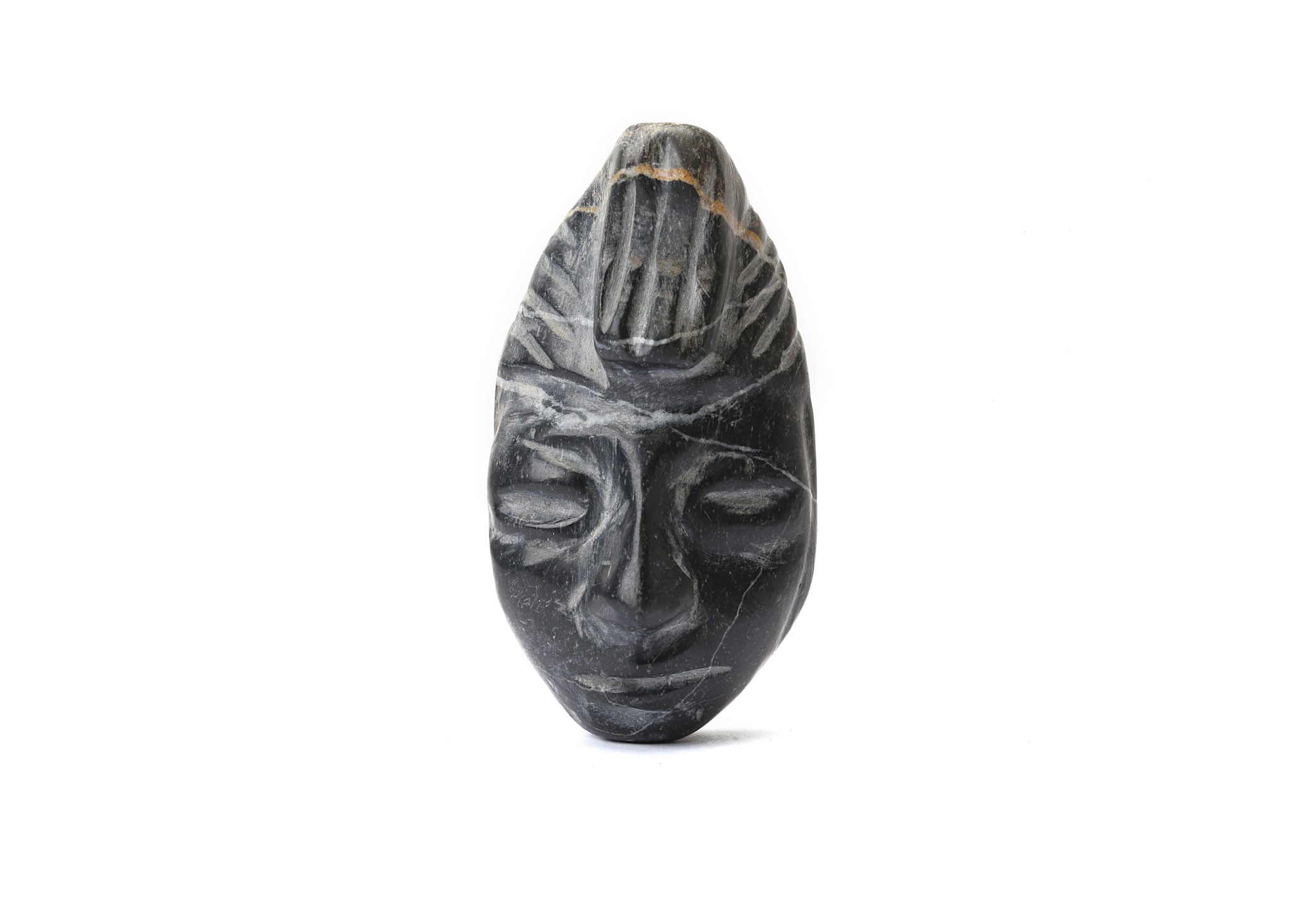 A STONE HEAD, CENTRAL AMERICA Carved in mottled grey stone with a shiny patina, the head wears a