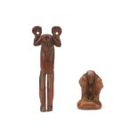 TWO POLYNESIAN WOOD FIGURES  One figure standing with arms raised, palms up, the palms pierced in