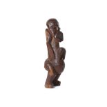 AN AFRICAN WOOD MONKEY FIGURE Of heavy hardwood, with a stylised large open mouth, square nose and