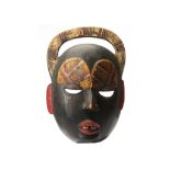 A PAINTED MASK, IVORY COAST With hollow hemispherical eyes, oblong ears, a prominent mouth with